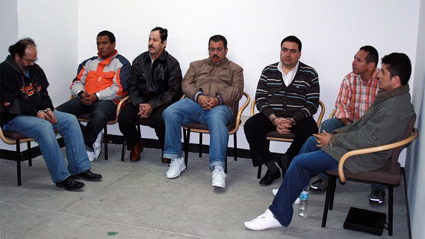 Colombian paramilitary members of the demobilized United Self-Defenses of Colombia (AUC) (L to R) Rodrigo Tovar, Manuel Torregrosa, Hernan Giraldo, Fernando Murillo, Francisco Zuloaga, Guillermo Alzate and Nodier Giraldo wait at the airport in Bogota, Colombia, before being extradited to the US, on May 13, 2008. Colombia on Tuesday extradited 14 of its nationals, including 13 paramilitary leaders, to the United States to face drug trafficking charges, Colombian Justice Minister Carlos Holguin announced. AFP PHOTO / POLICIA NACIONAL / AFP PHOTO / POLICIA NACIONAL / HO
